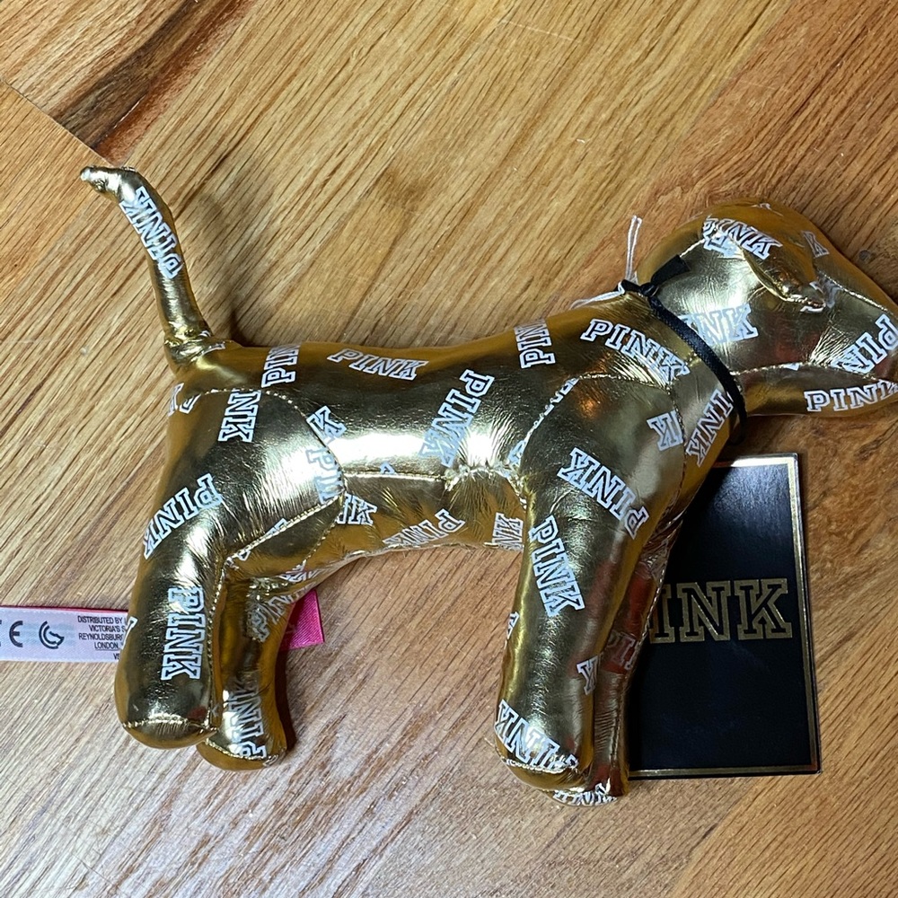 Pink Victoria’s Secret gold plush dog